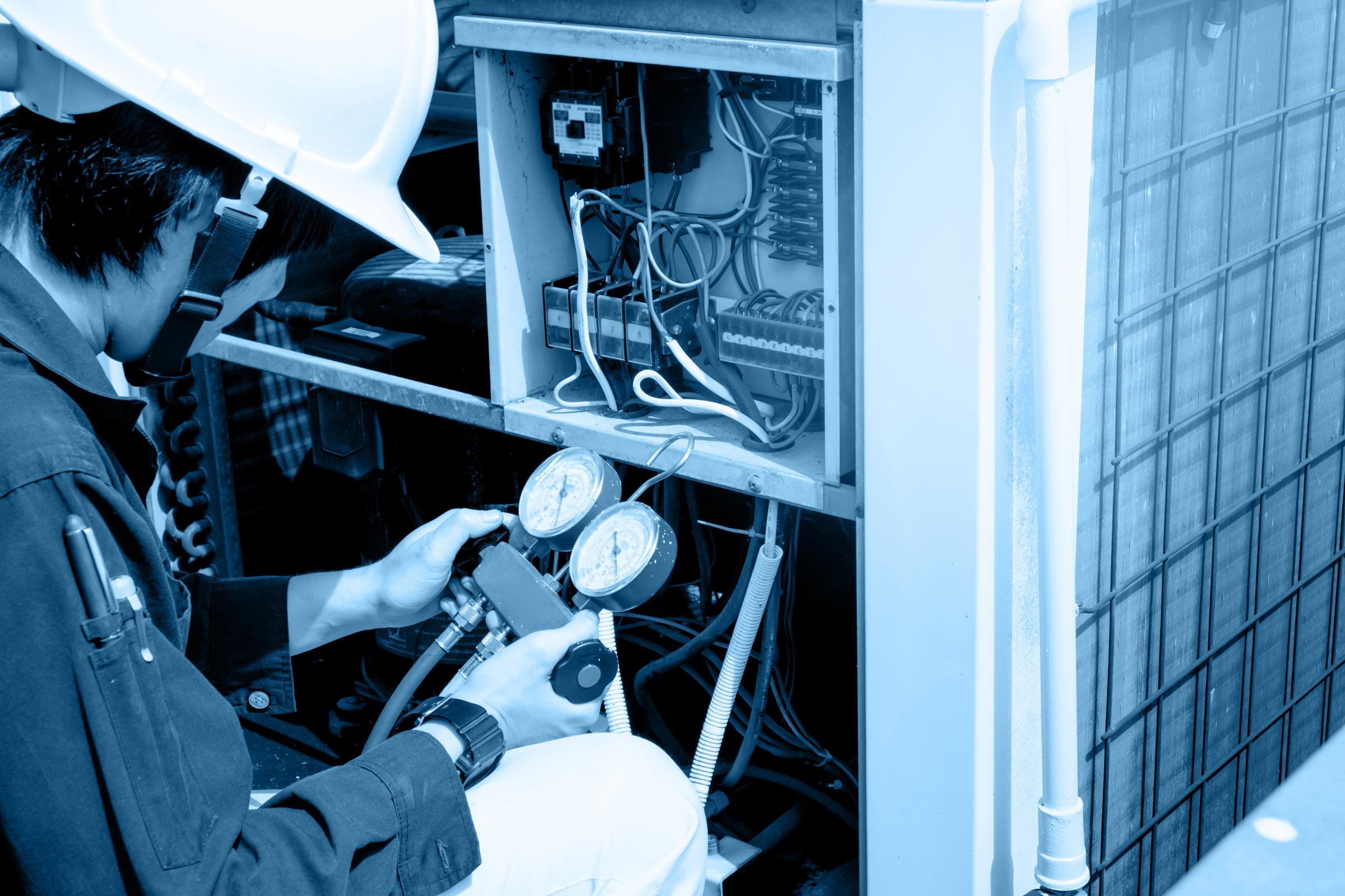 Technician Testing HVAC Equipment