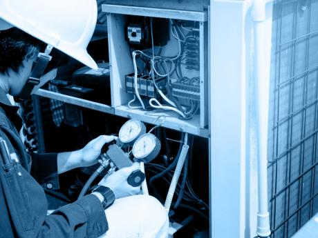 Technician Testing HVAC Equipment